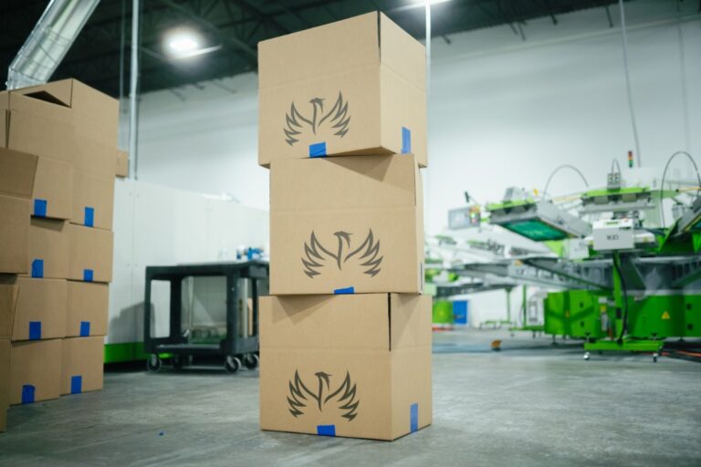 Boxed apparel orders stacked and labelled for delivery from the Naples facility